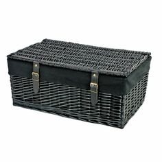 a black wicker basket with leather handles