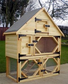 a chicken coop built into the side of a driveway