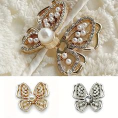 three different types of brooches with pearls and bows on top of each other