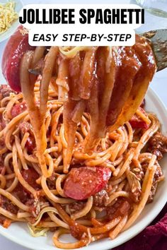 a white plate topped with spaghetti and meat