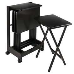 two black folding tables sitting next to each other