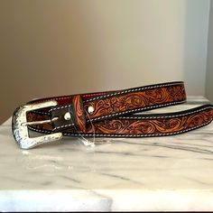 Dark Brown, Hand Tooled With Hide Inlay Leather Belt From Teskeys. Size 28” Longest Hole Measures At 29.50” And Shortest Hole Measures At 25.75”. See The Above Pictures Tooled Leather Womens Belt, Tooled Leather Belts Cheetah, Tooled Leather Belts Jacket, Tooled Leather Belts Cactus, Womens Tooled Western Belts, Hand Tooled Leather Necklace, Custom Hand Tooled Leather Belts, Cowgirl Belts, Bling Belts