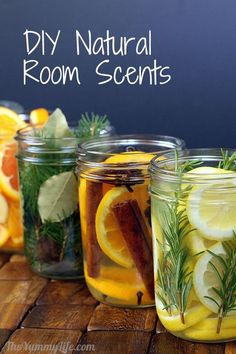 several mason jars filled with lemons and herbs