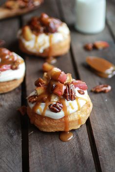 there are many donuts with toppings on top of them and one is drizzled with caramel