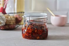 a glass jar filled with food sitting on top of a counter