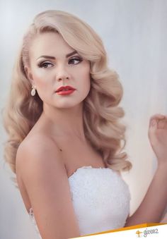 a woman with long blonde hair and red lipstick is posing for a magazine cover photo