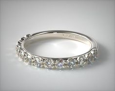 a white gold wedding band with round cut diamonds