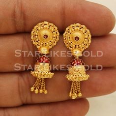 Elevate your style with these beautifully handcrafted gold earrings. Featuring a classic design and a comfortable fit, they add a refined touch to any look. Ideal for everyday wear or special occasions, they bring a subtle yet sophisticated sparkle. 22K Gold Earrings Metal is Real Gold Purity is 22kt Weight is 7.69 grams approx. Max Length is 3.6 centimeter approx. Max width is 1.3 centimeter approx. The earrings come with normal backs if you real gold screw please contact Please feel free to as Luxury Fusion Yellow Gold Jhumkas, Luxury Yellow Gold Jhumkas As Gift, Cheap Gold Temple Jewelry Danglers, Luxury Gold-plated Chandbalis For Celebration, Luxury Gold Chandbalis For Ceremonial Occasion, Old Buttalu Earrings Gold, Luxury Gold Chandbalis For Festivals, Long Buttalu Earrings Gold, Bugdi Earrings Gold