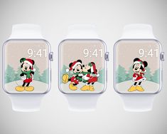 three smart watches with mickey and minnie mouses on the front, one in santa claus's hat