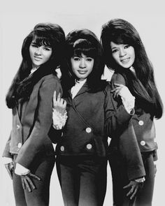 three young women standing next to each other