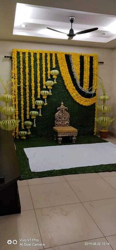 a stage decorated with yellow and green flowers