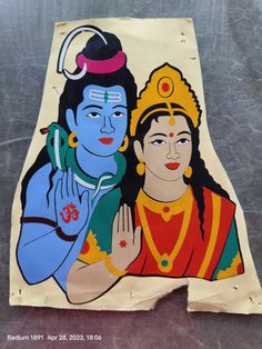 an image of two people painted on a piece of paper