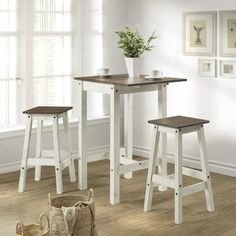 three stools and a table in a room