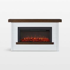 an electric fireplace with red flames on the side and dark wood top, against a white wall