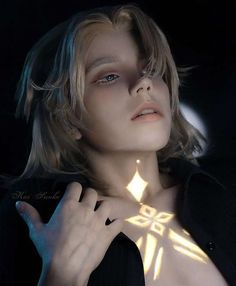 a woman wearing a black shirt and tie with light shining on her chest in the dark