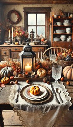 a dining room table set with pumpkins and candles