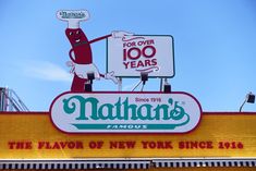 the sign for nathan's famous hot dog restaurant