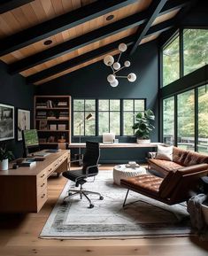 a living room filled with furniture and lots of windows