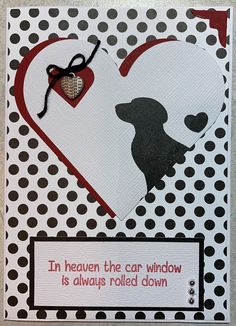 a card with a dog on it and a heart hanging from the front, which says i'm heaven the car window is always rolled down