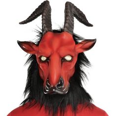 Release the beast from the burning hellfire in this devilish mask. The red latex mask features a goat head with skewed brown horns blank white eyes pointy red ears and a long black beard. Hellfire Beast Mask product details:  Latex mask  Mesh eyes Attached faux fur Secures by elastic band   One size fits most teens and adults Beast Mask, Goat Mask, Black Beard, Mens Hairstyles With Beard, Goat Head, Red Mask, Black Beards, A Goat, Halloween Costume Shop