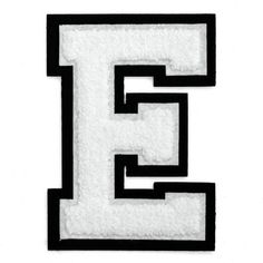 the letter e is made out of white and black felt with an outline in the middle