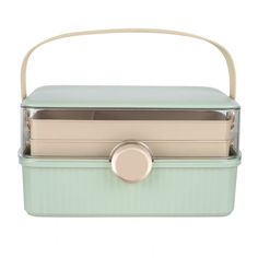 a mint green lunch box with two compartments and a handle on the front, sitting against a white background