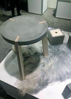 a dog laying on top of a white table