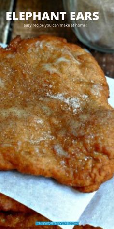 an image of some food that is on top of wax paper and has the words elephant ears written in it