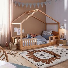 a child's bedroom with a bed and rug