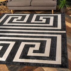 a black and white area rug in a living room