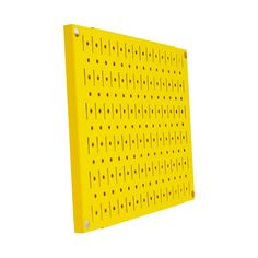 a yellow peg board with holes on it