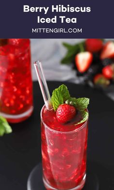 berry hibiscus iced tea with mint garnish and strawberries on the side