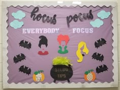 a bulletin board decorated with halloween decorations and writing on the front, along with words that read house pets everybody focus