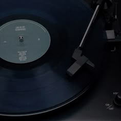 an old record player with its turntable turned on and the disc is still in it's place