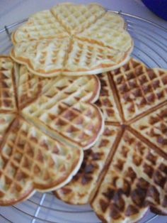 several waffles are arranged on a cooling rack