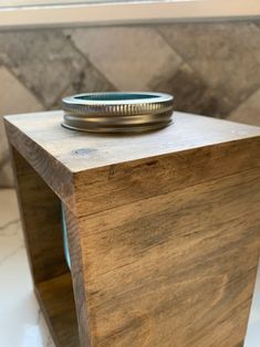 a mason jar sitting on top of a wooden box