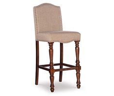 an upholstered bar stool with nail polishing on the legs and backrests