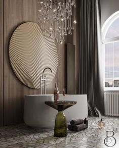 a bathroom with a round mirror and chandelier above the bathtub is shown