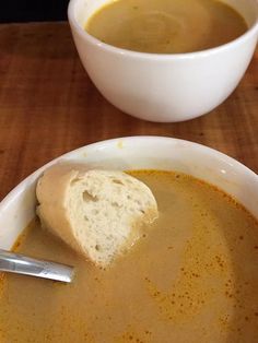 a bowl of soup with bread in it