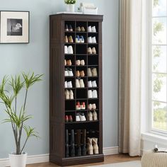 a wooden shoe rack filled with lots of shoes