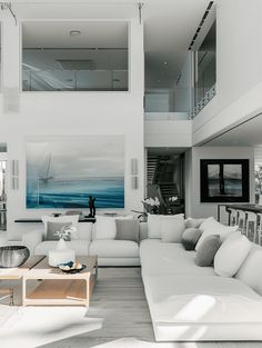 a living room filled with furniture and white walls