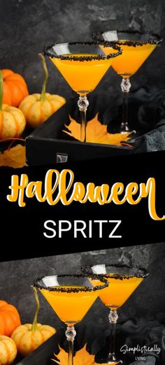 three halloween spritz cocktails with orange and black garnish