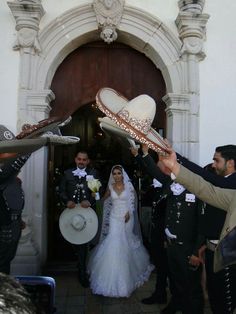 the bride and groom are getting ready to walk down the aisle