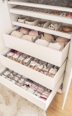 the drawers are filled with shoes and other items