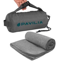 a person holding onto a roll of yoga mat with the word pavillia printed on it