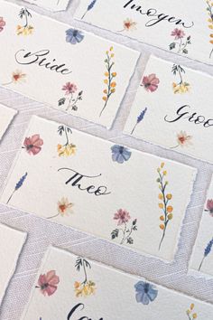 some cards with flowers on them are laid out