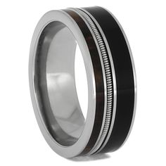 a black and white wedding ring with silver inlays on the inside of it