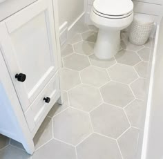 Makoto 10 x 11.5 Hexagon Matte Porcelain Tile in Kumo Grey Mosaics Bedrosians Tile Bathroom Tile Floor Small Space, Hexagon Tile Master Bath, Non Tile Bathroom Flooring, Matte Hexagon Tile Bathroom, Hall Bathroom Floor Tile, Light Grey Hexagon Tile Bathroom Floor, Large Honeycomb Floor Tile, 8 Inch Hexagon Tile Floor Bathroom, Ceramic Floor Bathroom