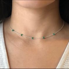 This Thin And And Minimal Necklace Is Designed With 5 Tiny, Genuine, Zambian Emerald Gemstones, Evenly Spaced Along A Dainty Sterling Silver Chain And Completed With A Sterling Silver Lobster-Claw Clasp. These Earth-Mined Stones Are Finely Faceted And Reflect Light Beautifully. Note, The Five Gems Are Placed Only On The Focal Segment Of This Necklace For A True Minimal Look. Genuine Emerald Is The Symbol Of Spiritual Awareness, Protection, Love, And Wisdom. This Dainty And Minimalist Necklace Is Emerald Choker, Cactus Necklace, Water Pearl Necklace, Emerald Dresses, Beaded Necklace Designs, May Birthday, Layered Necklaces Silver, Minimal Necklace, Heart Locket Necklace