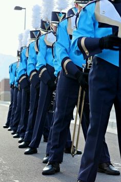 a marching band is lined up on the street